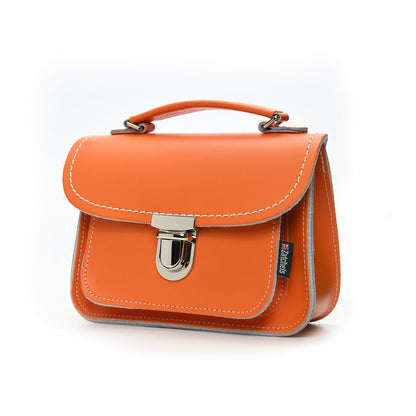 Luna Handmade Leather Bag in vibrant orange, showcasing premium craftsmanship and elegant push lock clasp, perfect for stylish crossbody wear.