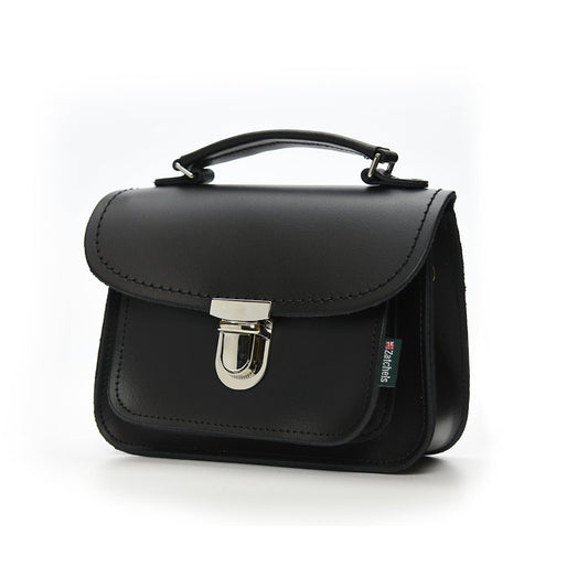Close-up of Luna Handmade Black Leather Bag featuring luxurious UK-sourced leather, secure push lock clasp, and top handle detail for sophisticated use.