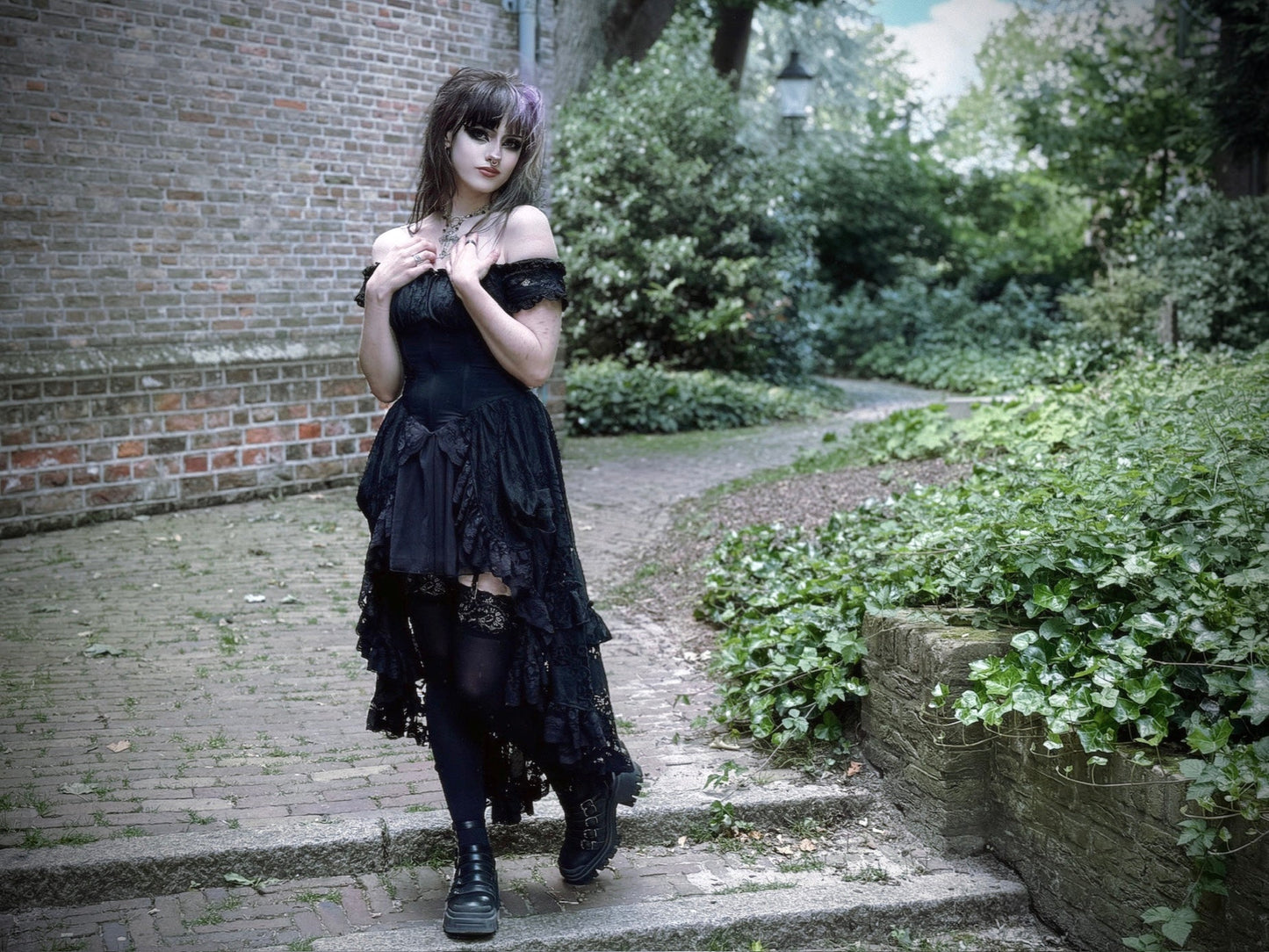 Close-up detail of the lace-up back of the Dark In Love Lilinoe Off Shoulder Dress, highlighting its chic and sophisticated styling.