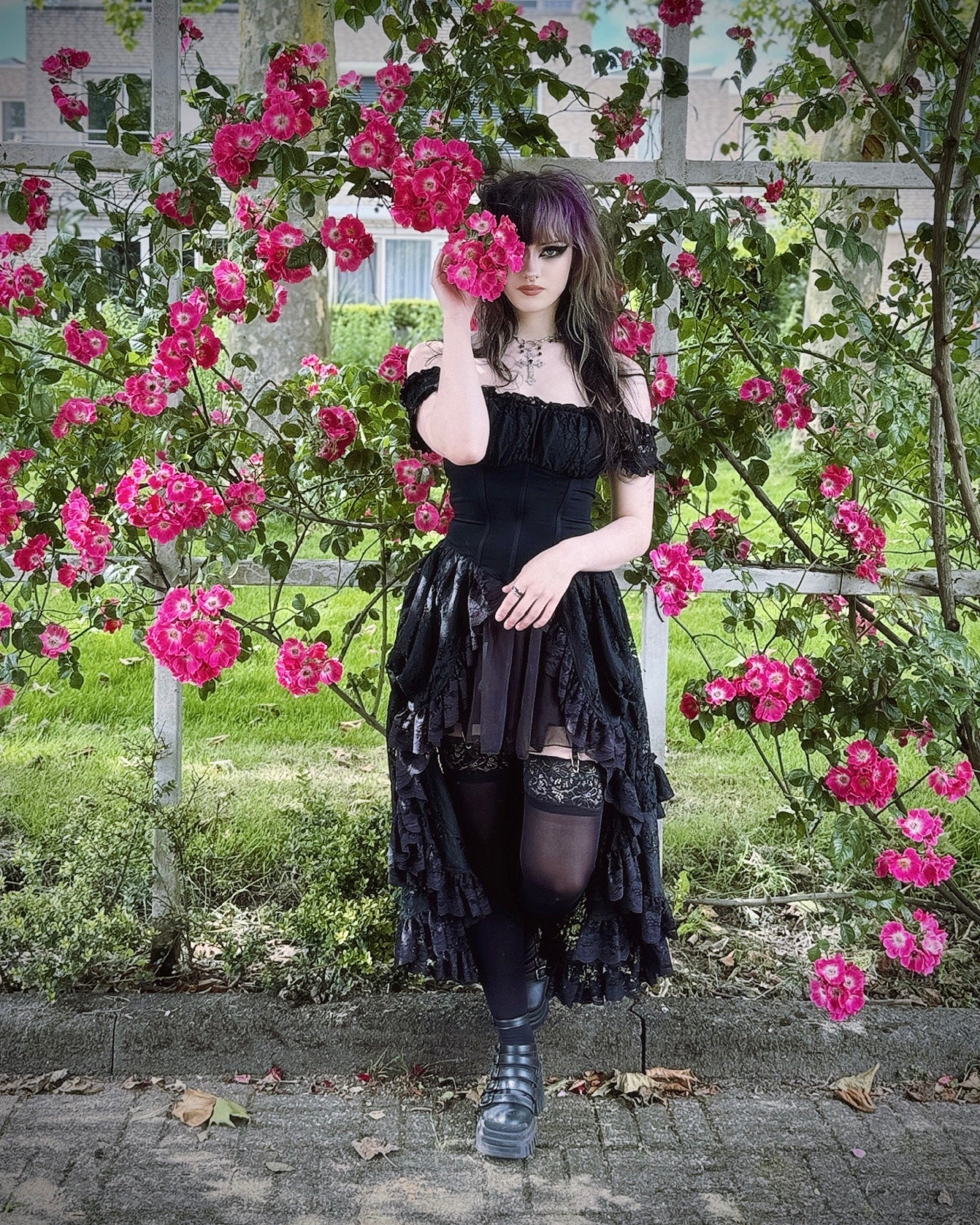 Back view of the Dark In Love Lilinoe Off Shoulder Dress displaying the intricate lace-up design, perfect for a luxurious evening look.