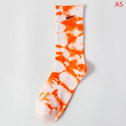 Luxurious Women's Tie-Dye Middle Tube Socks in vibrant orange and white pattern, offering vibrant comfort for all-day style.