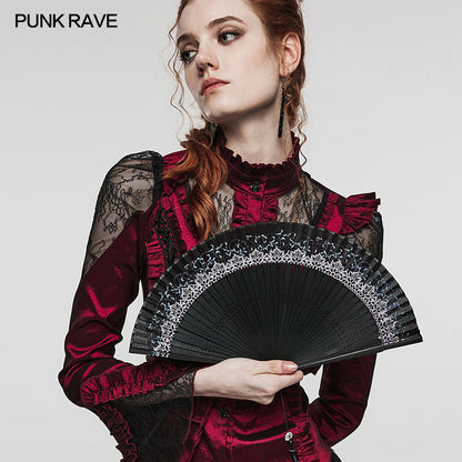 Punk Rave Delaney Hand Fan in action, elegantly held at a gig, adding a touch of sophistication.