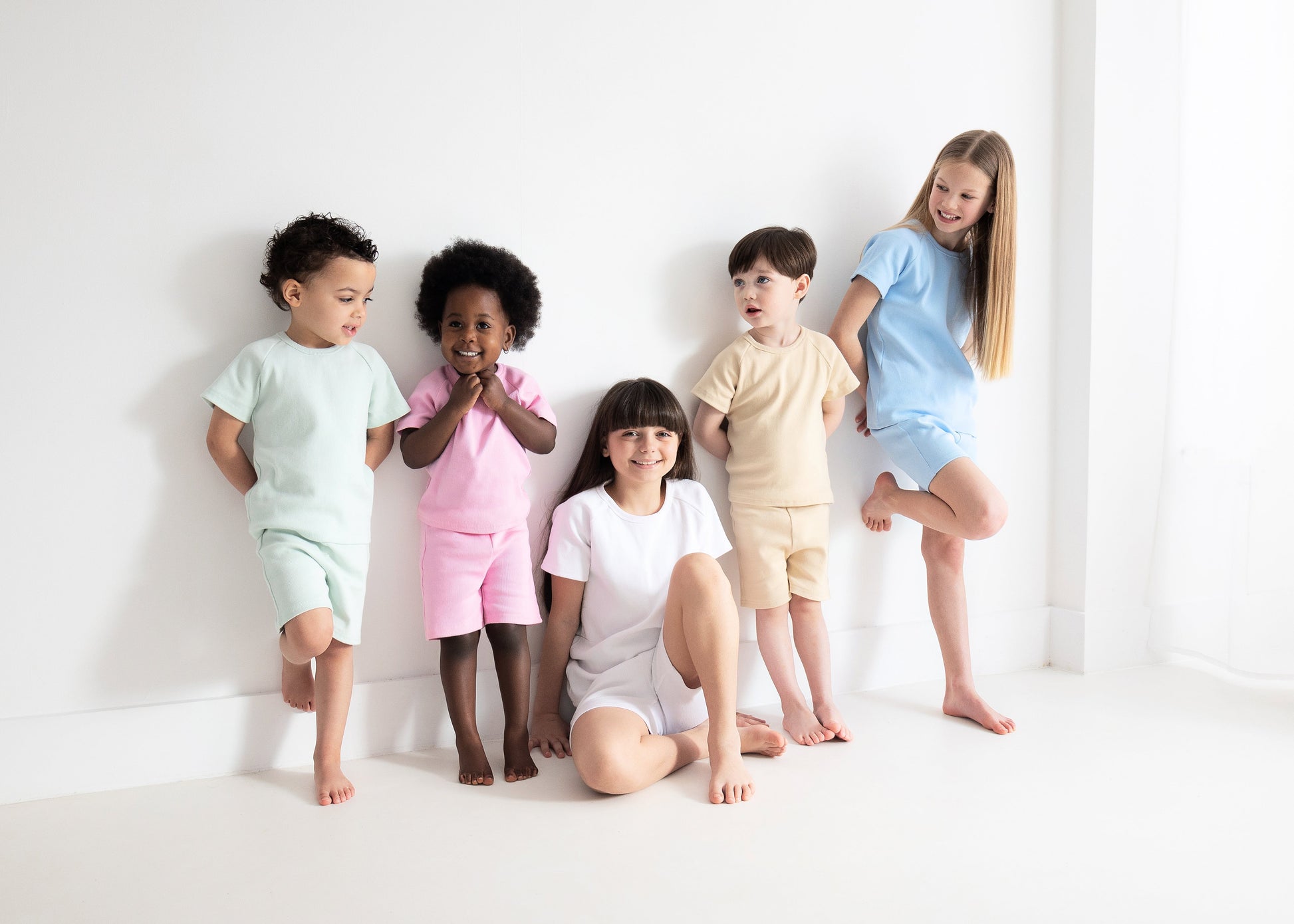 DreamBuy luxurious baby shorts and shirt set in pristine white, perfect for summer wear, emphasizing comfort and breathability for active children.