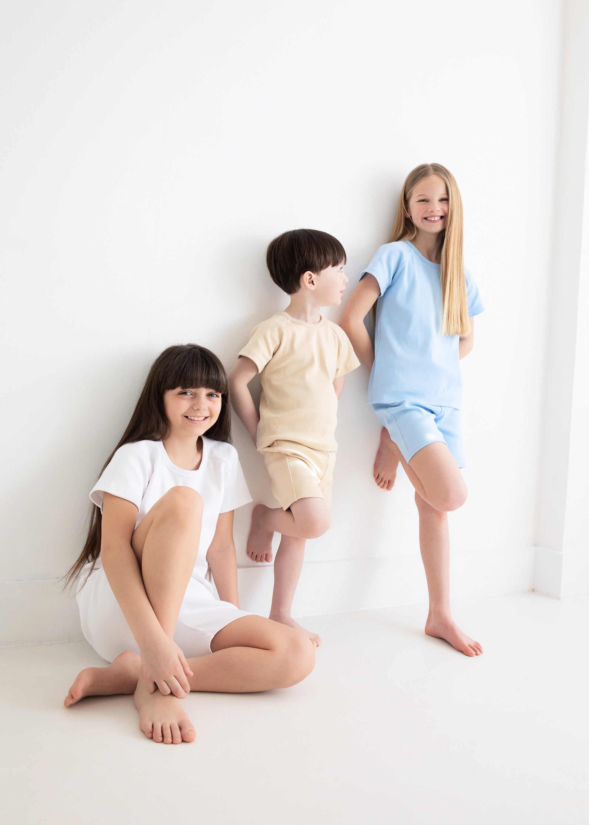 DreamBuy unisex kids white summer shorts outfit set made from soft premium ribbed cotton, showcasing versatile and comfortable fashion for children.