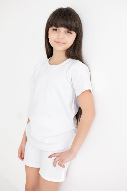 Premium unisex kids white summer shorts outfit set by DreamBuy, crafted from soft ribbed cotton for ultimate comfort and style.