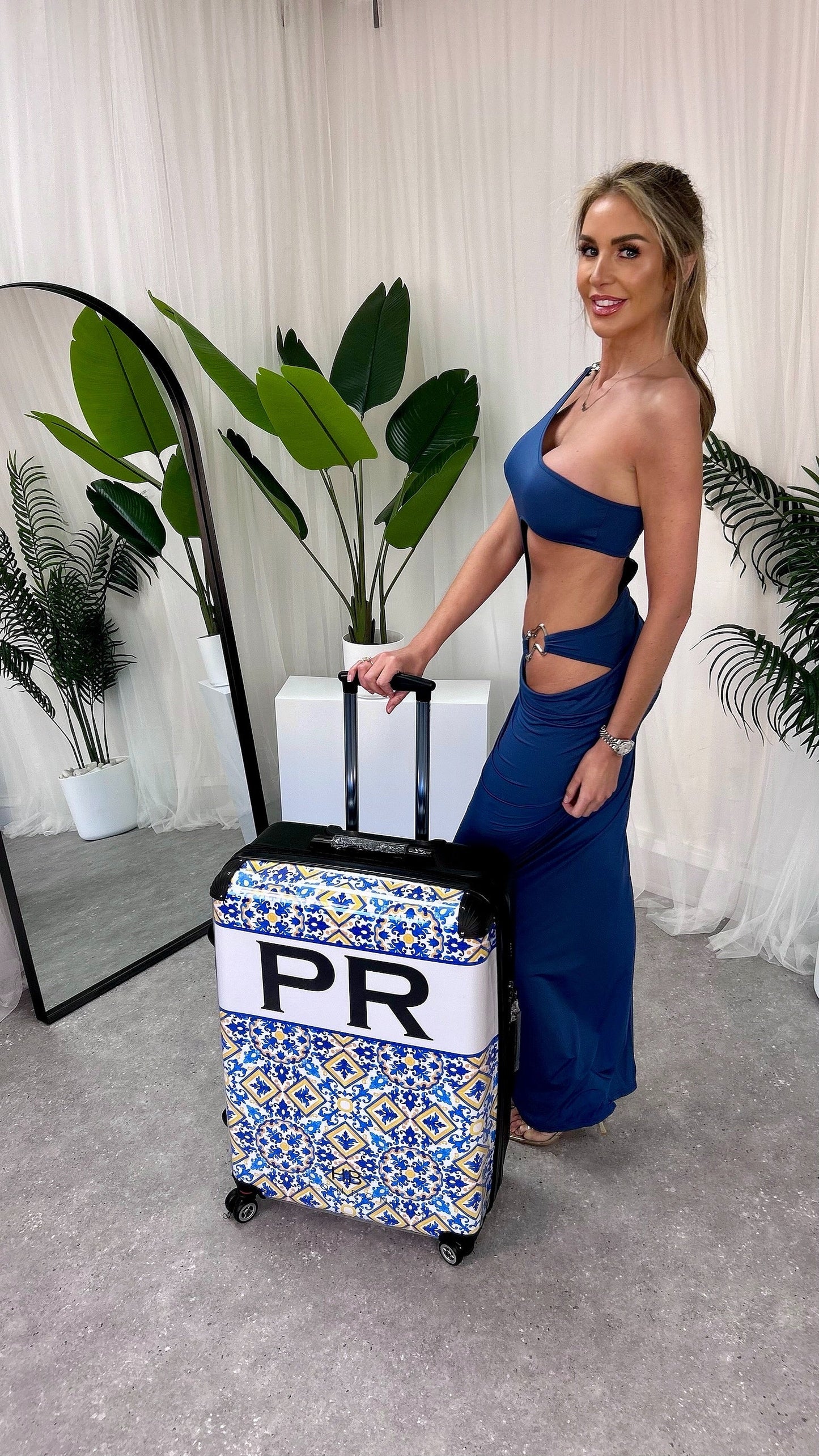 Luxury Ariel Cut Out Maxi Dress featuring a stylish one-shoulder design, perfect for celebrations. Available in sizes S to L, showcasing a flattering fitted silhouette and playful cheeky cut-out detail.