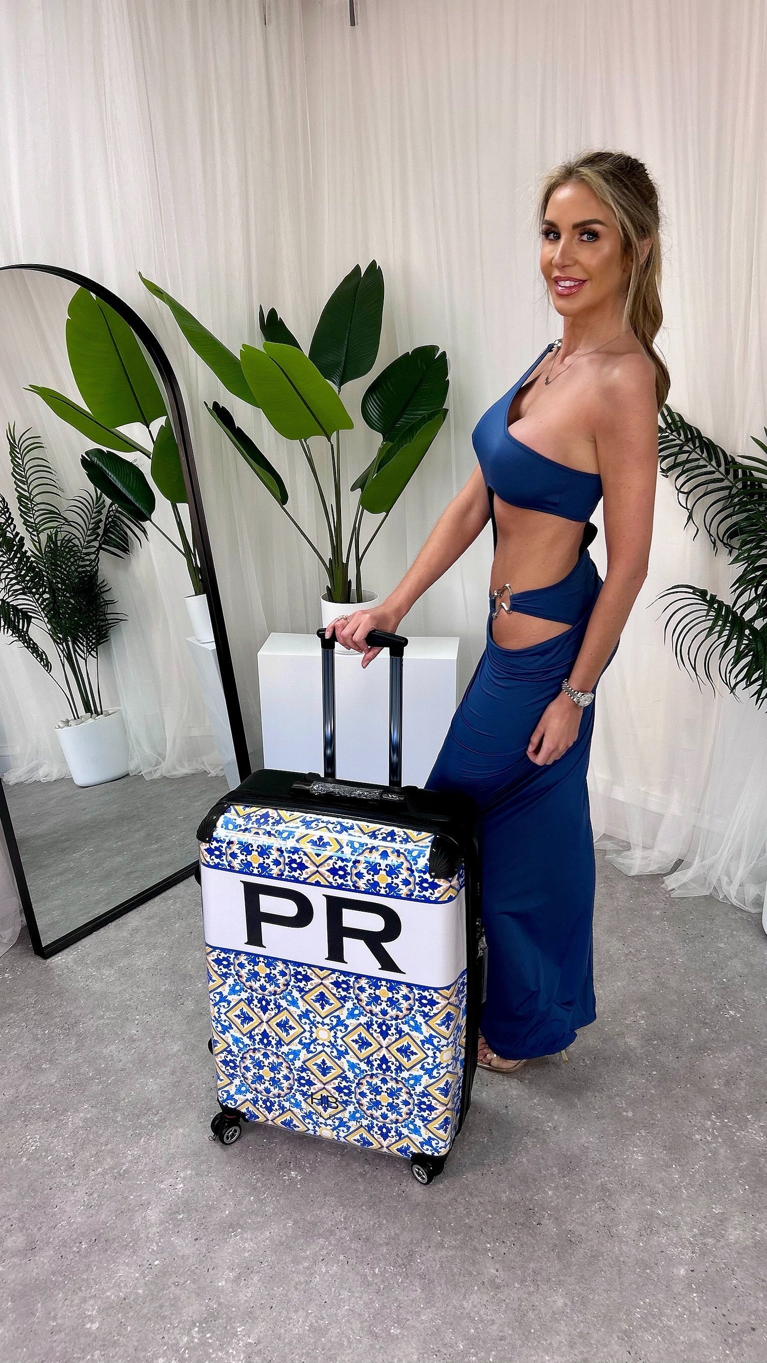 Luxury Ariel Cut Out Maxi Dress featuring a stylish one-shoulder design, perfect for celebrations. Available in sizes S to L, showcasing a flattering fitted silhouette and playful cheeky cut-out detail.