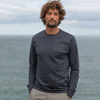 Luxurious long sleeve recycled sweatshirt made of 70% regenerated cotton, elegantly designed with set-in sleeves for a sophisticated look.