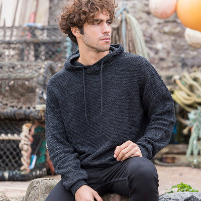 Luxurious Iguazu Recycled Knitted Hoodie showcasing chunky tuck stitch design, ideal for sustainable fashion lovers.