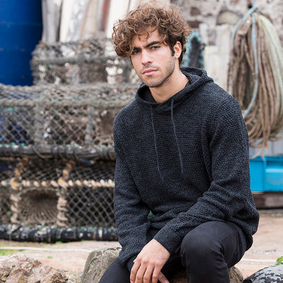 Iguazu recycled knitted hoodie featuring chunky tuck stitch with ribbed cuffs and hem, designed for a stylish and sustainable lifestyle.