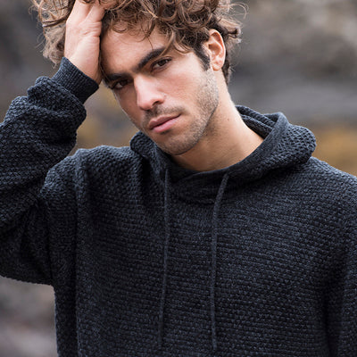 Model wearing the Iguazu recycled knitted hoodie, demonstrating its perfect fit and style across sizes XS to 2XL.