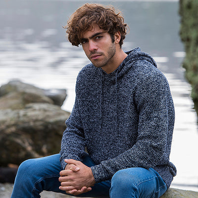 Eco-friendly Iguazu Knitted Hoodie showcasing ribbed cuffs and hem, made with 70% regenerated cotton for a sustainable wardrobe.