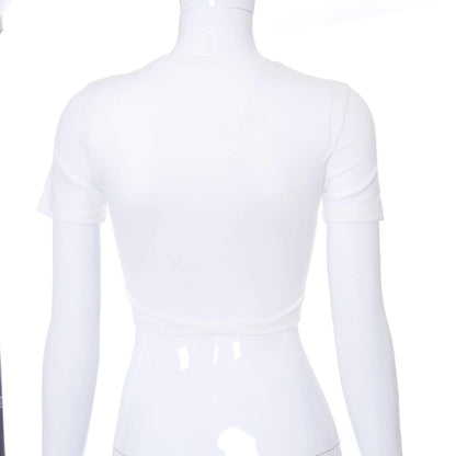 Close-up of the metallic chain detail on the Daring Chain Cropped Women's Tee by Dazzling Dreams Studio, adding a luxurious accent to urban streetwear.