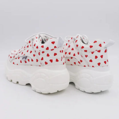 Stylishly crafted white sneaker with heart motifs, designed for chic casual wear.