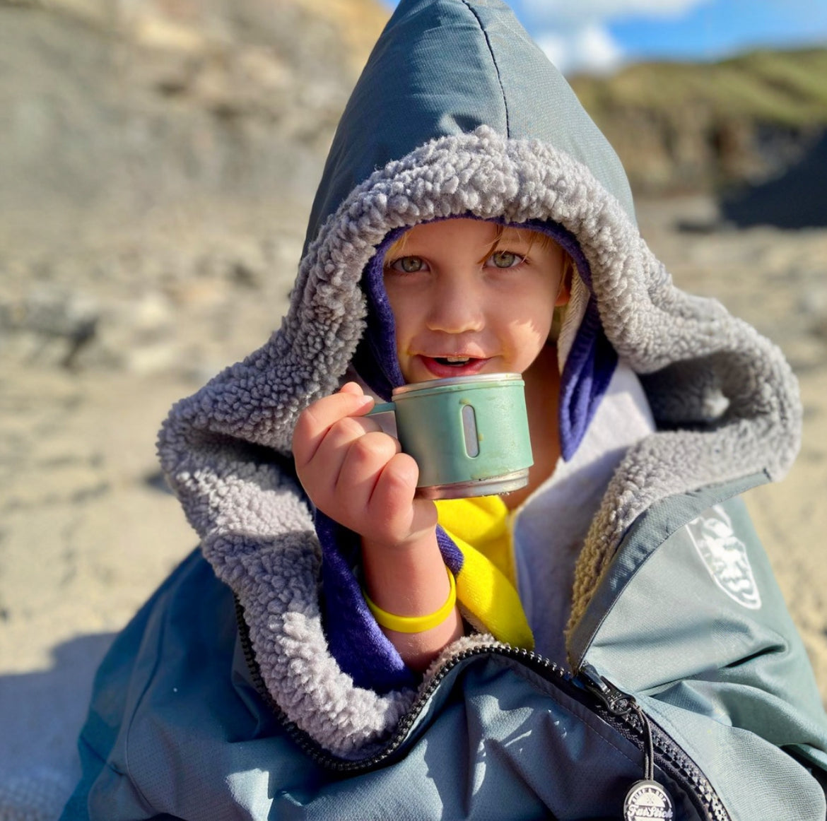 Luxury waterproof recycled fleece changing robe 'FatWrap' showcasing its exquisite design and premium quality, perfect for beach and outdoor adventures.