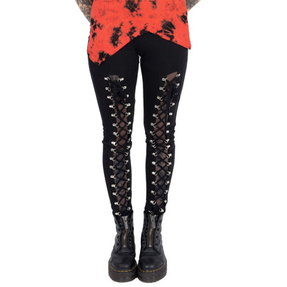 Model wearing Vixxsin Giada Lace-Up Leggings, exuding a chic rocker vibe, featuring a sleek silhouette ideal for fashionable outfits.