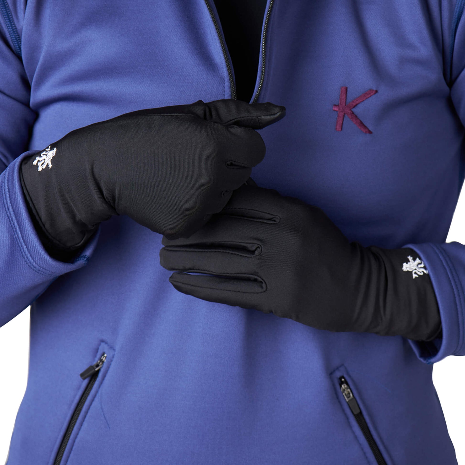 Stylish KYMIRA infrared glove liners displayed in assorted sizes, embodying comfort and modern luxury for the discerning wearer.