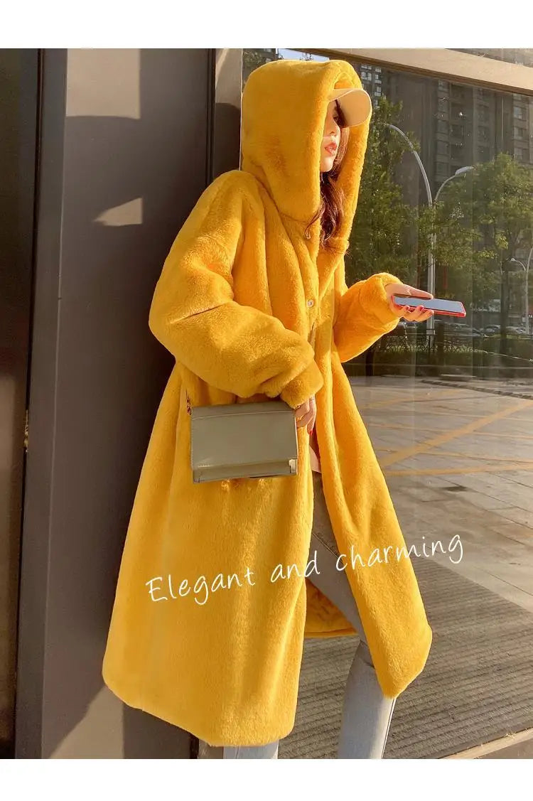 Stylish women’s faux fur hooded coat with flattering fit, featuring cozy pockets and modern design for a warm, luxurious winter attire.