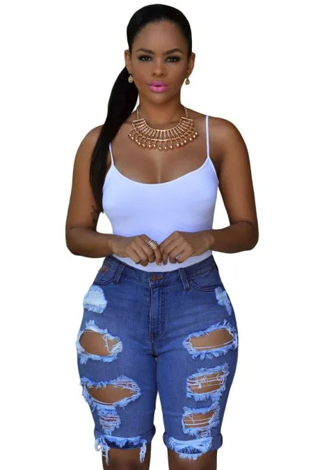 Model wearing luxury women's summer ripped denim shorts, highlighting the comfortable stretch fit and stylish ripped design for a trendy casual look.