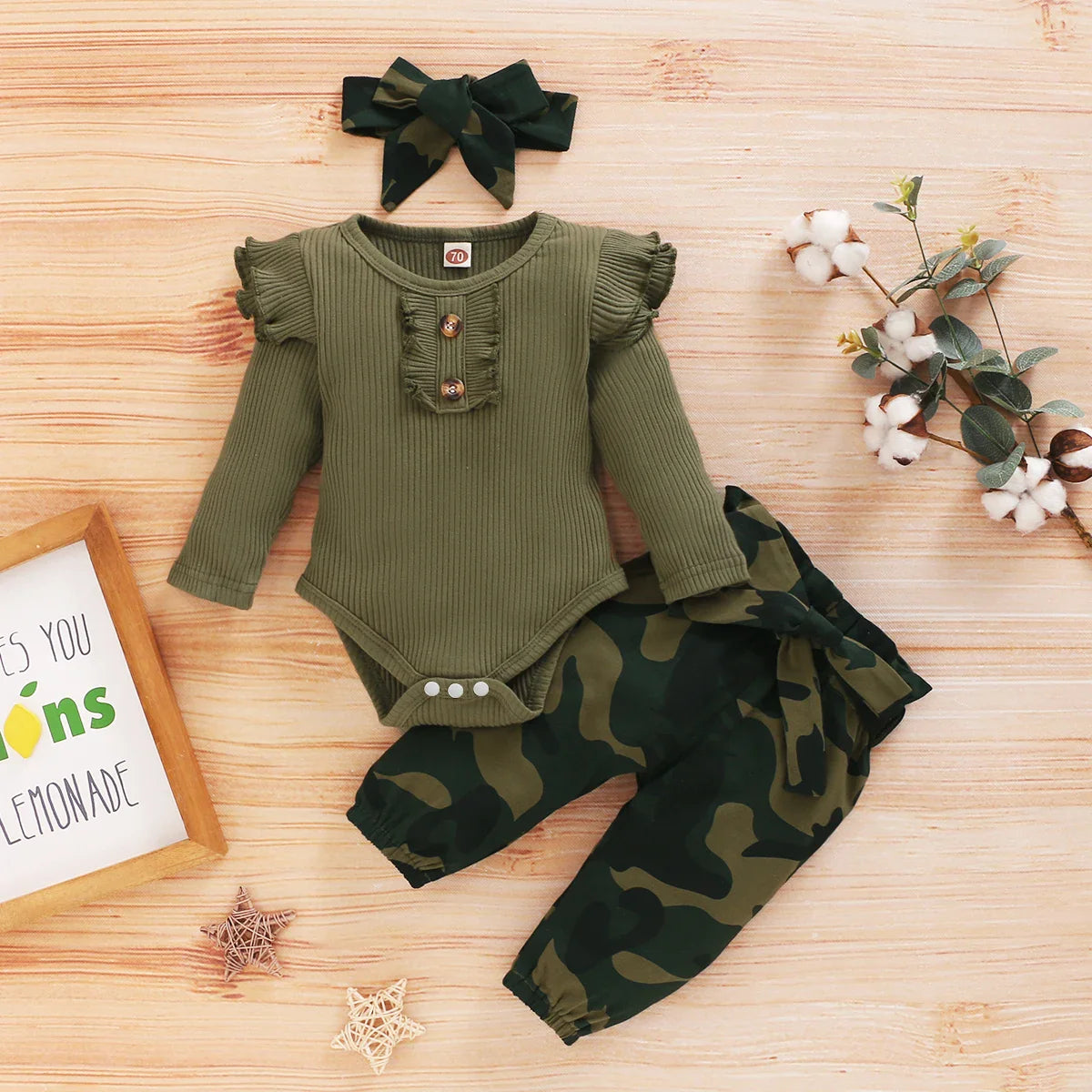 Luxury camouflage baby clothes set on display, highlighting the comfortable and premium fabric, designed for boys and girls aged 0-12 months.