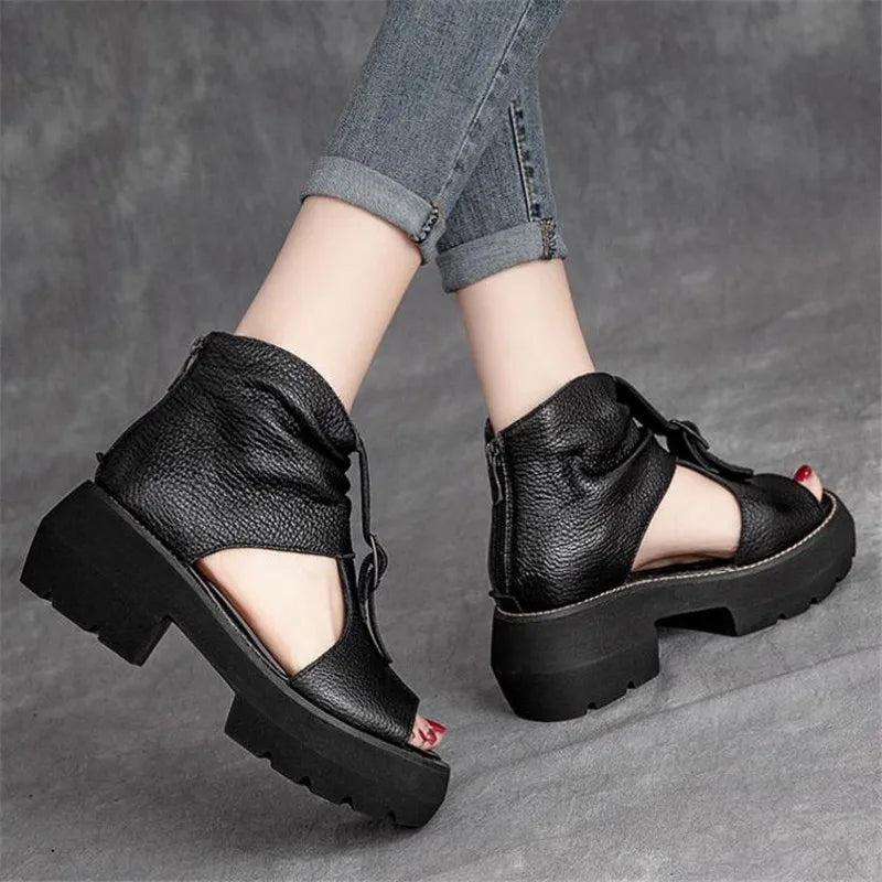 Women's vintage gladiator sandals crafted from genuine leather, featuring a mid heel and stylish open toe design.