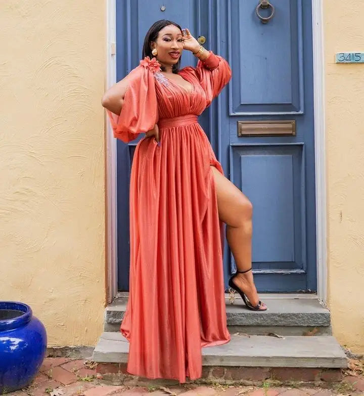 Chic layout of a plus size African maxi dress with long sleeves, capturing the beauty of polyester fabric in a luxurious kanga design.