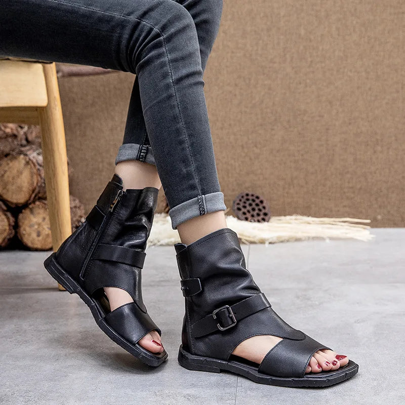 Elegant flat sandals made from genuine cow leather, featuring a beautiful metal decoration, perfect for casual occasions.