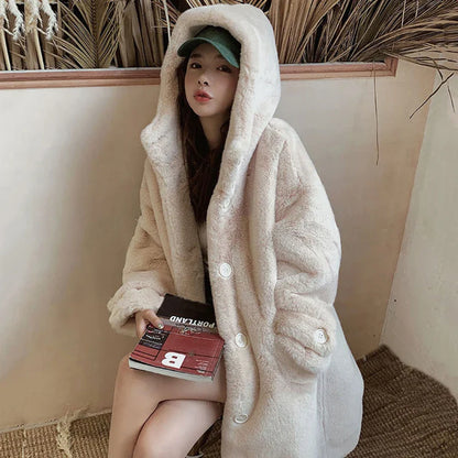 Luxurious women's hooded faux rabbit fur coat in thick plush fabric, featuring elegant pockets, perfect for winter styling and warmth.