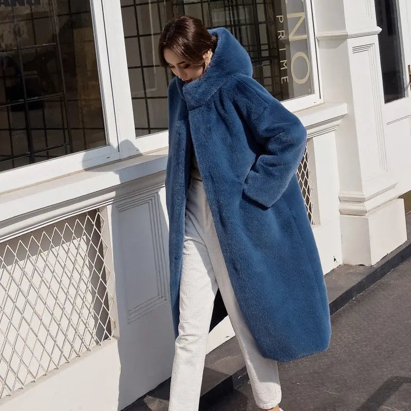 Stylish Women's Faux Fur Overcoat paired with elegant winter accessories, embodying a luxurious winter look perfect for the modern woman.