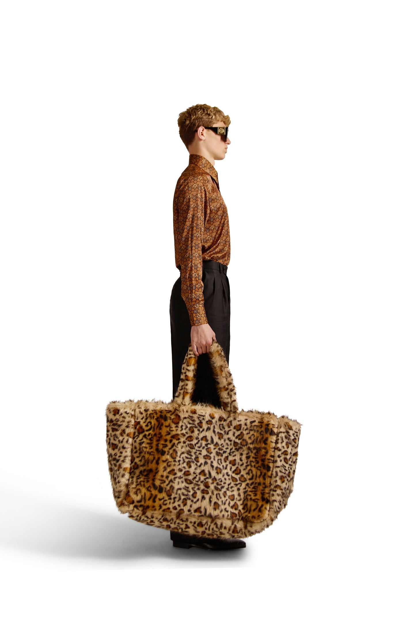 Detail of two-button mitered cuffs with concealed one-button pleated placket, highlighting the craftsmanship of a luxury tailored shirt.