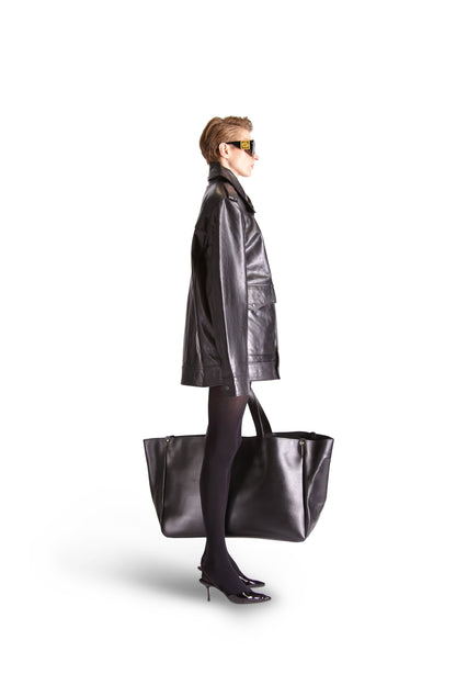 Stylish oversized leather shoulder bag from Helen Anthony displayed against a minimalist background, showcasing its sleek lines and modern design.