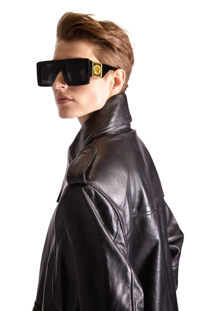 Elegant oversized leather tote bag by Helen Anthony featuring dual inside zips, a chic button close pouch, and multiple slip pockets, ideal for sophisticated style and practical use.