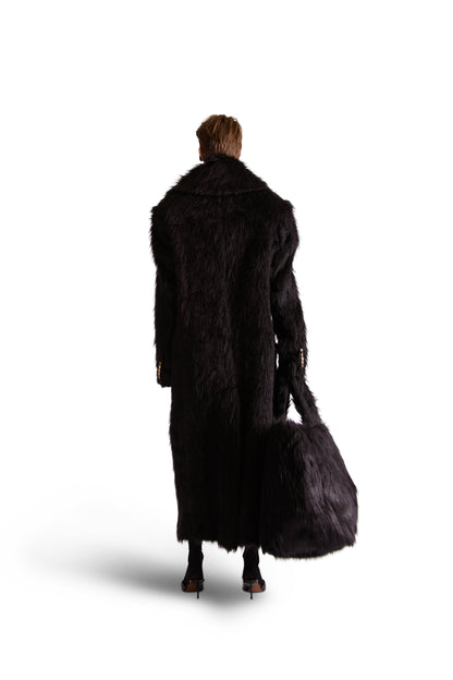 Detail shot of the button closure pouch of the luxury faux fur shoulder bag, made in Italy, exuding sophistication and utility.