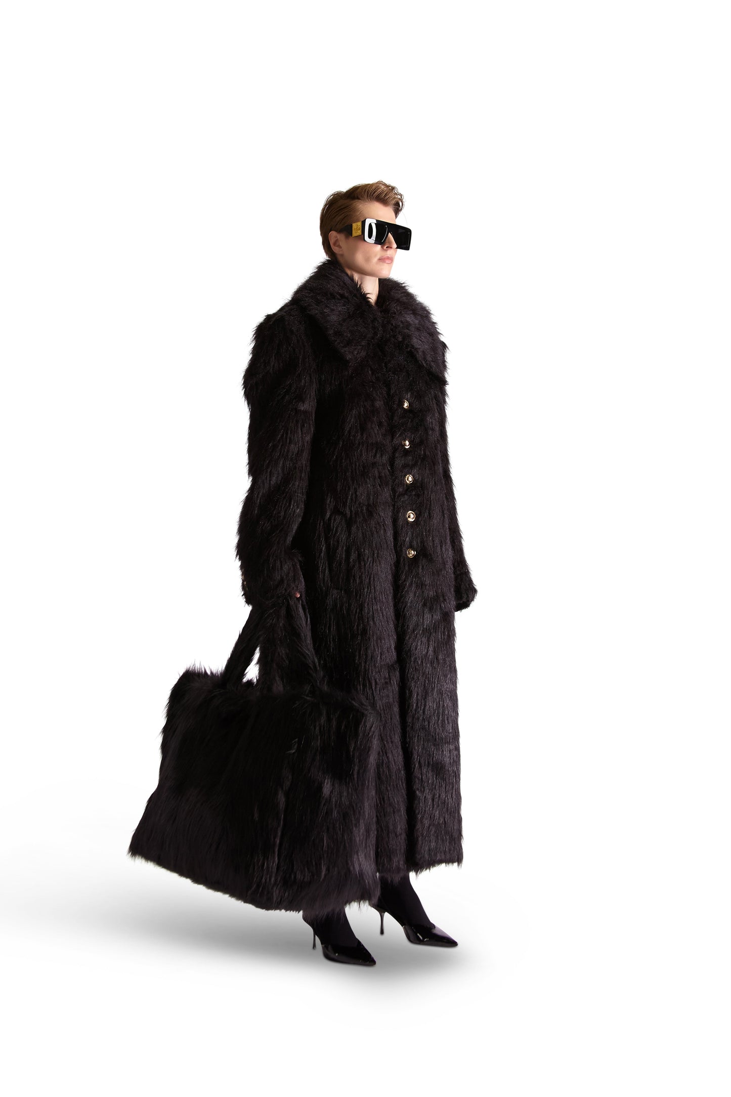 Luxury oversized faux fur shoulder bag with multiple pockets, crafted in Italy, showcasing a stylish design for elegant outings.