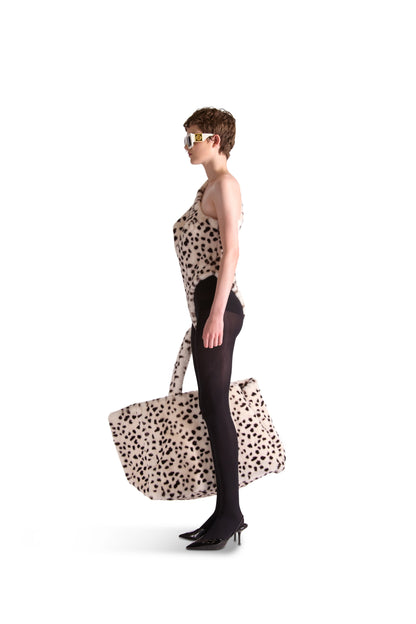 Sophisticated overview of the oversized animal print faux fur bag with metal hook closure, designed for the contemporary luxury shopper.