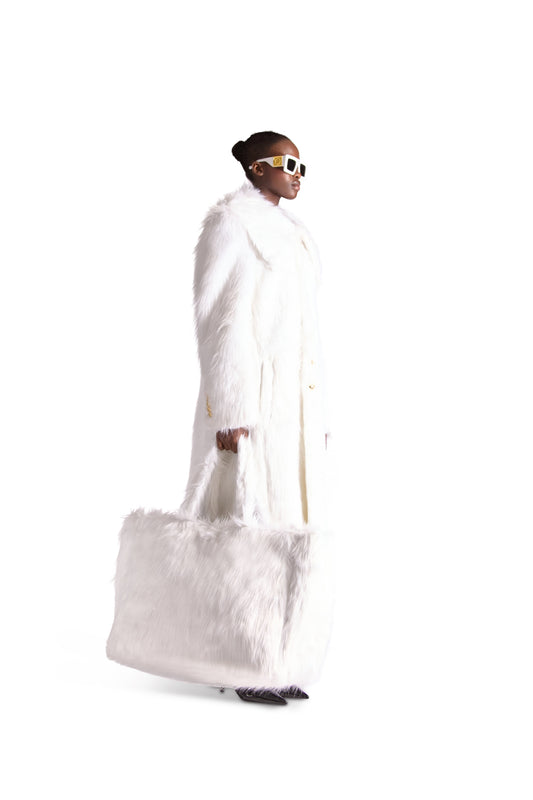 Close-up view of the sophisticated faux fur texture on an oversized shoulder bag, showcasing its plush elegance and luxurious design.