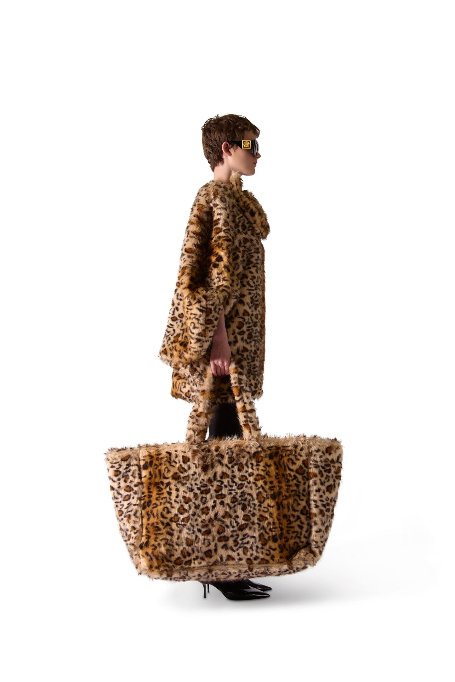 Interior view of the oversized animal print faux fur shoulder bag, highlighting the double inside zips and spacious button-close pouch.