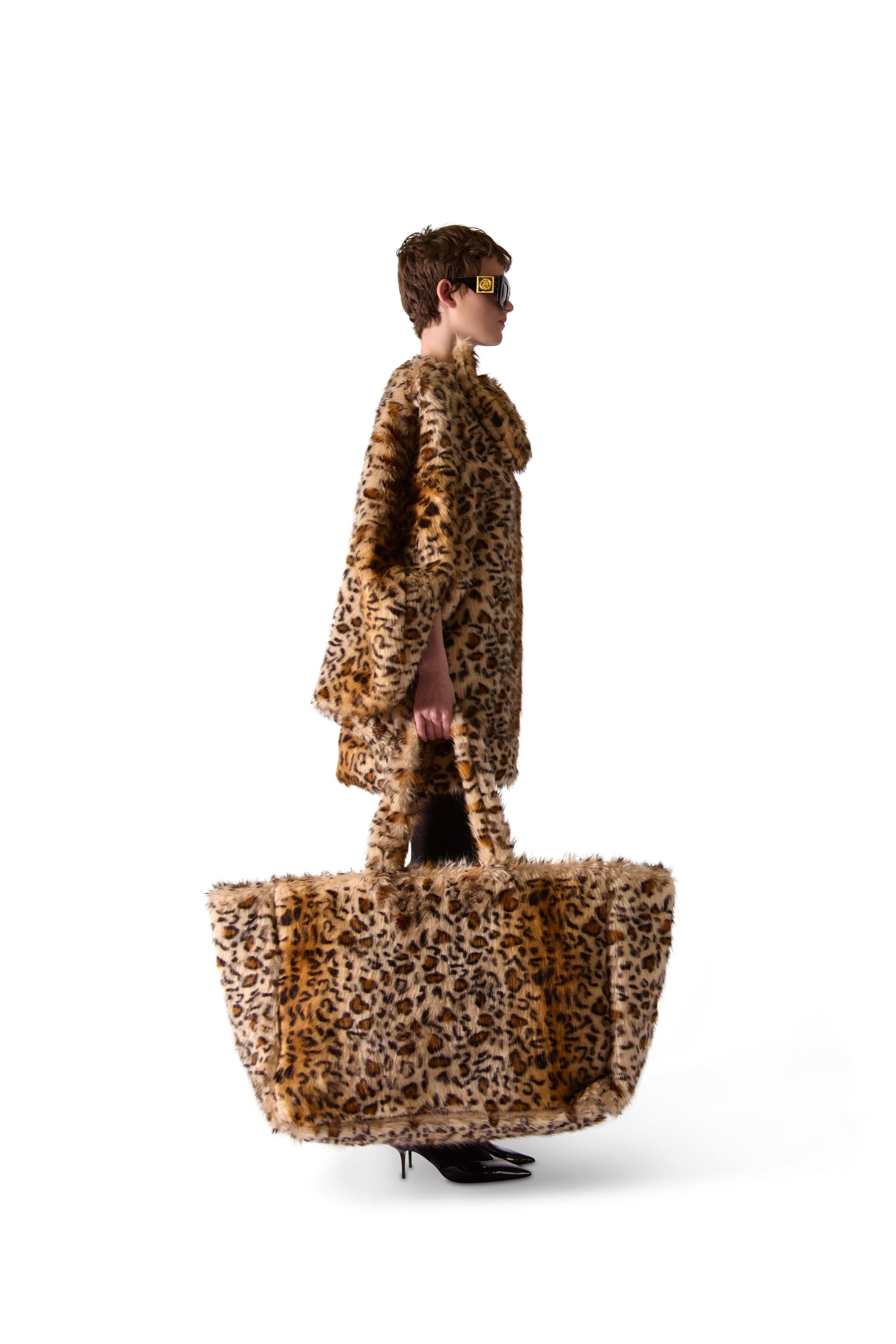 Interior view of the oversized animal print faux fur shoulder bag, highlighting the double inside zips and spacious button-close pouch.