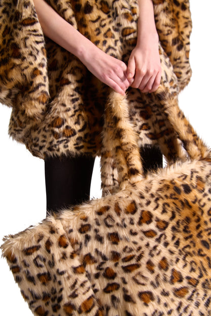 Close-up of the elegant faux fur texture of Helen Anthony's oversized shoulder bag, showcasing its sophisticated animal print pattern and stylish metal hook closure.