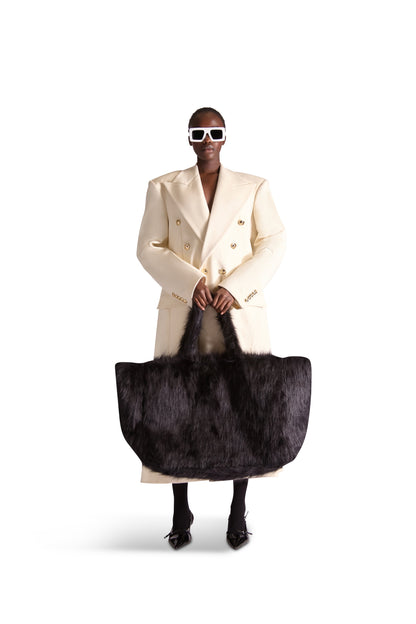 Elegant Helen Anthony oversized faux fur shoulder bag in luxurious cream, showcasing inside zip pockets and a chic design, measuring 24" x 16" x 10.5".