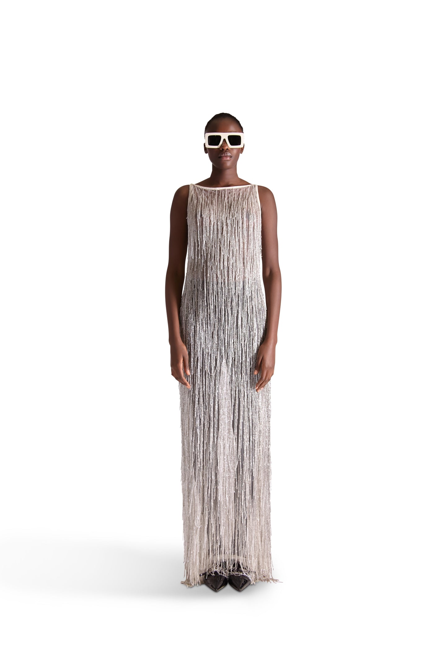 Luxurious hand embroidered tassel beaded sleeveless sheer evening dress displayed on a model, featuring a round neckline and floor-length mesh fabric, exuding elegance and sophistication.