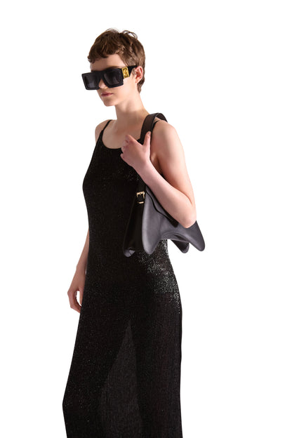 Detailed close-up of the katdana bead embroidery on a luxury evening dress, showcasing fine craftsmanship and style.