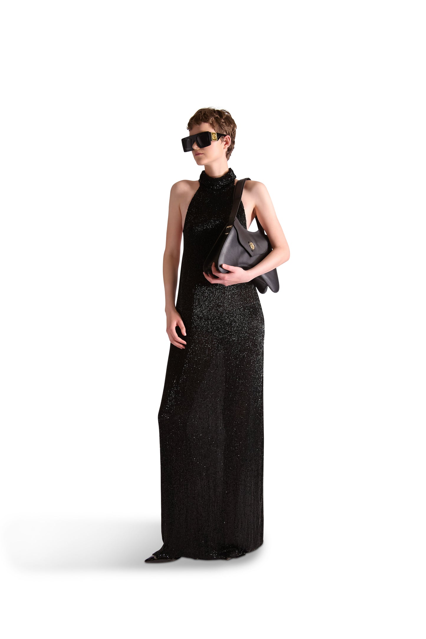 Detail view of a luxury evening dress demonstrating the intricate katdana beadwork and high neck collar, epitomising sophistication and style.