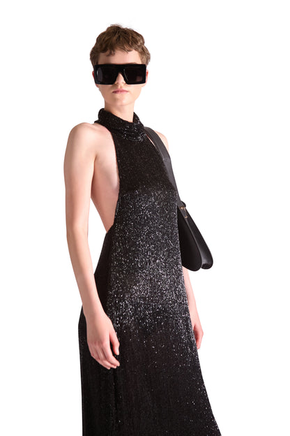 Elegant backless evening gown featuring silk lining and a stylish high neck collar, perfect for formal occasions.