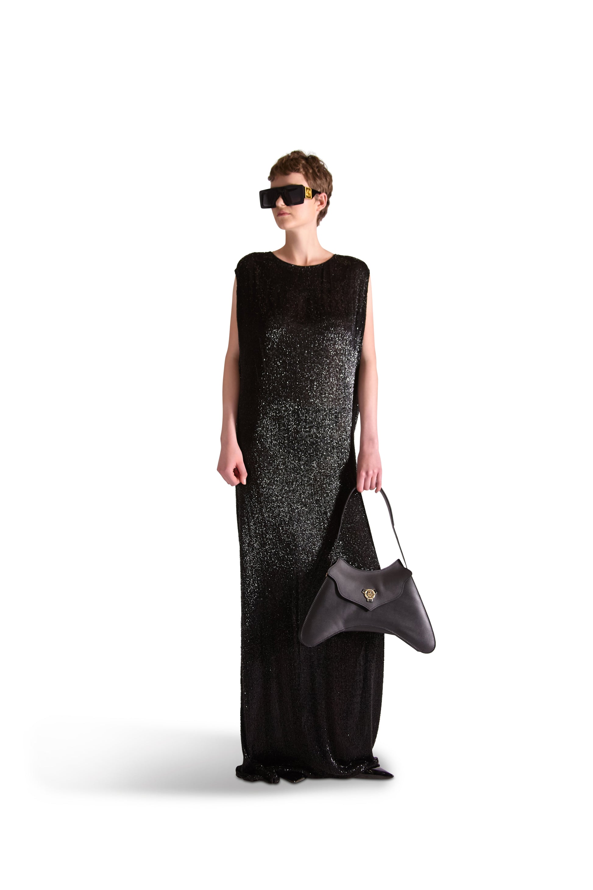 Showcasing the flowing silhouette of a luxury hand embroidered evening dress ideal for elegant events.