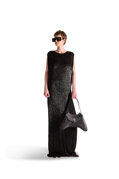 Showcasing the flowing silhouette of a luxury hand embroidered evening dress ideal for elegant events.
