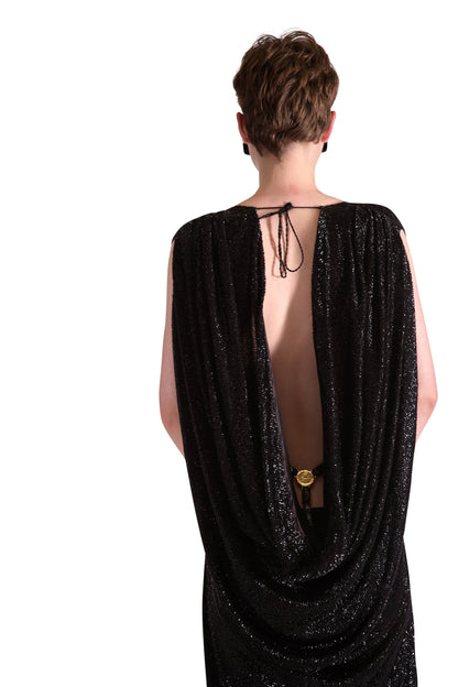 Close-up of exquisite hand embroidered katdana beads on a luxurious silk lined evening dress.