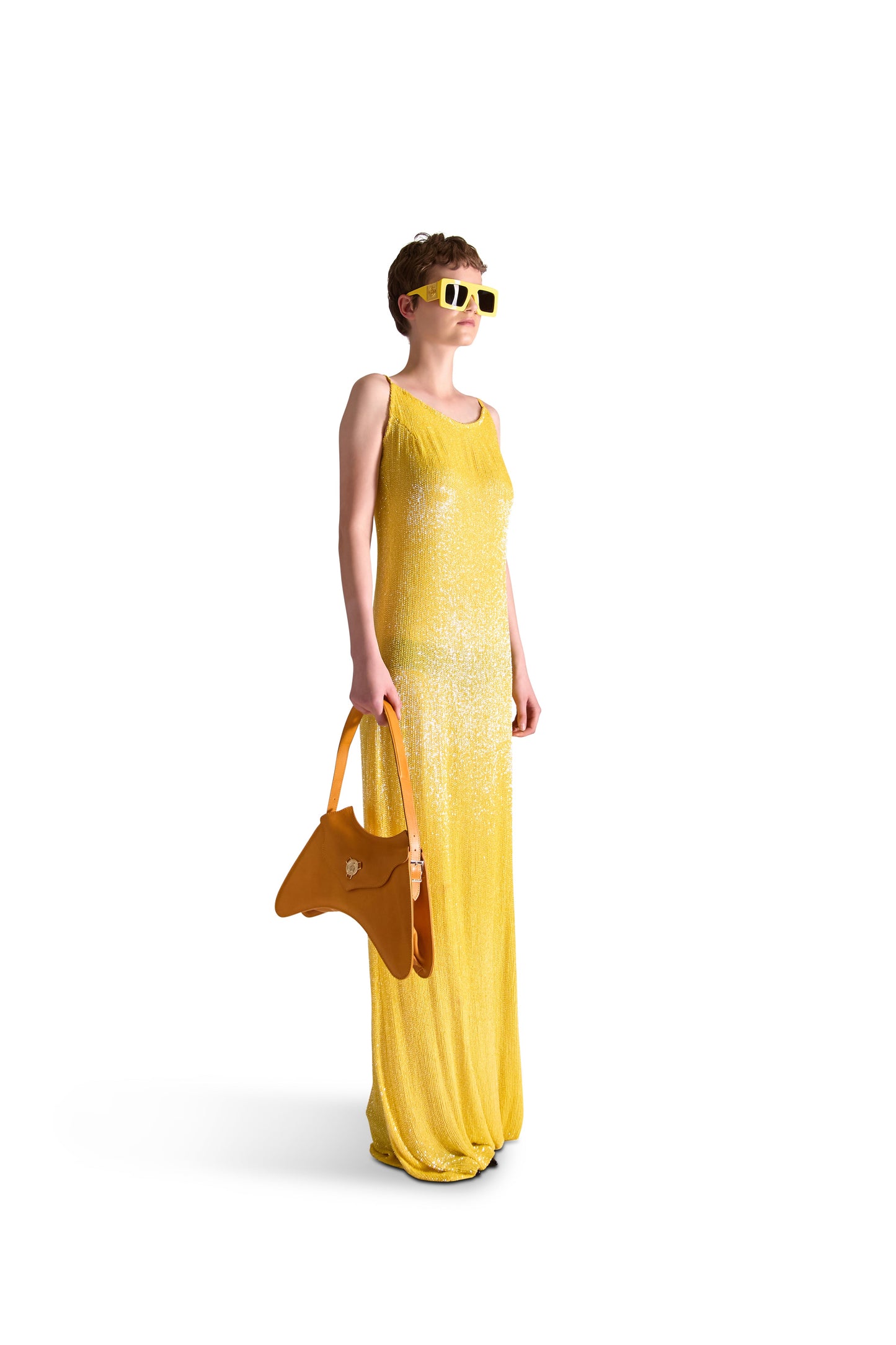 Elegant rounded neckline of a luxury spaghetti strap evening gown, featuring hand embroidered details, perfect for formal occasions.