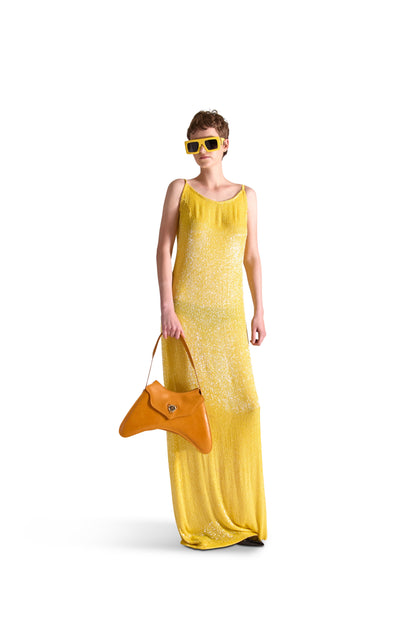 Floor length evening dress in silk, adorned with intricate katdana beading, highlighting the luxurious craftsmanship of Helen Anthony.