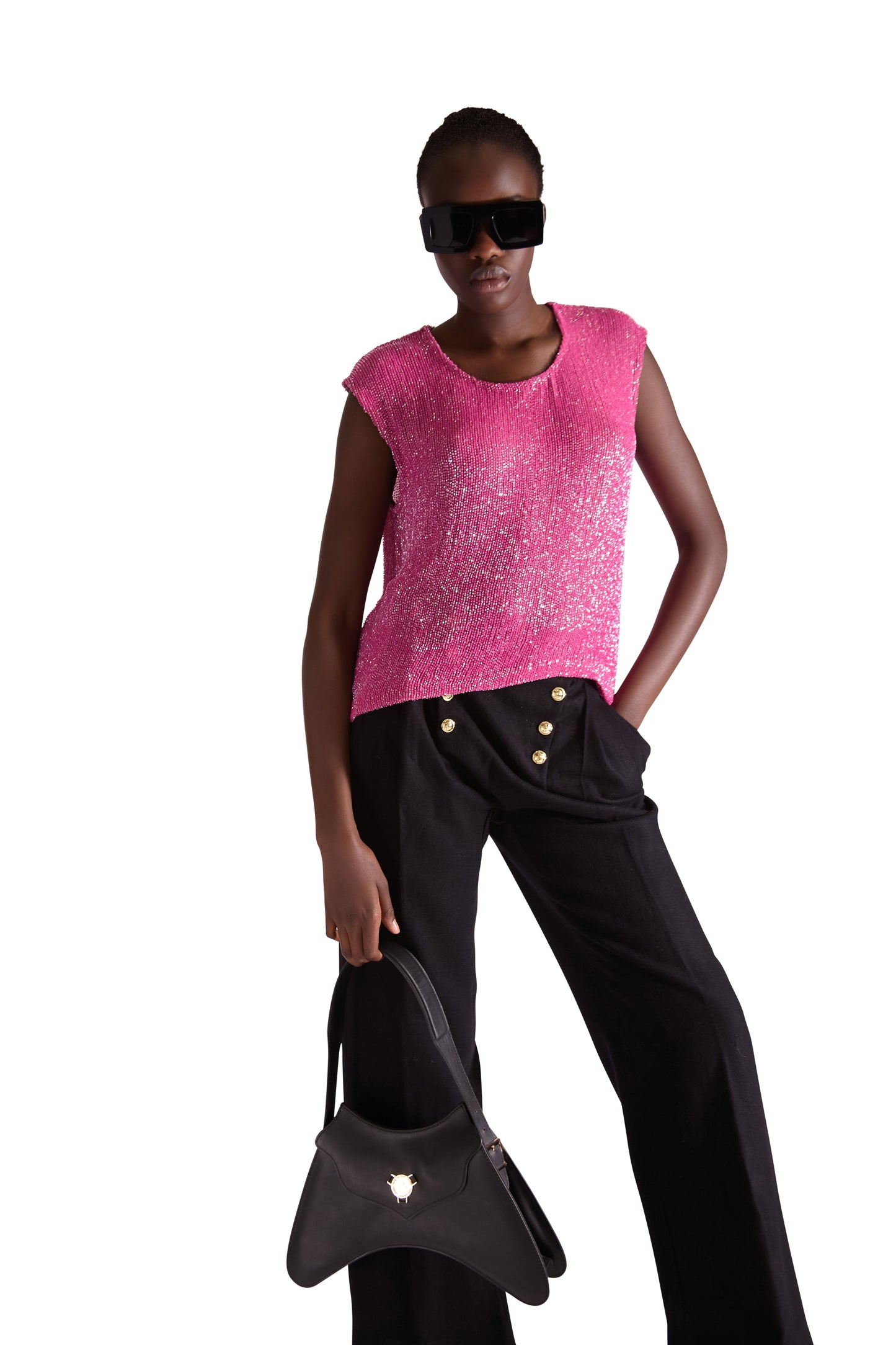 Close-up of luxurious katdana bead embroidery on a sleeveless silk top, featuring refined craftsmanship and exquisite detailing.